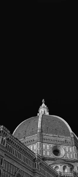 St Mary of the Flower iconic dome in Florence seen from below, built by italian architect Brunelleschi in the 15th century and symbol of Renaissance in the world (Black and White with copy space above)