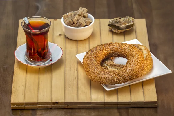 Turkish bagel, simit with Turkish tea on wood table