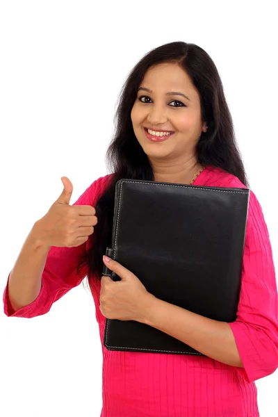 Happy female student holding folder and making thumb up gesture — Stock Photo, Image