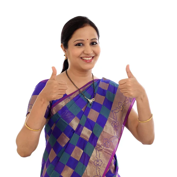 Happy traditional young woman making thumbs up gesture — Stock Photo, Image