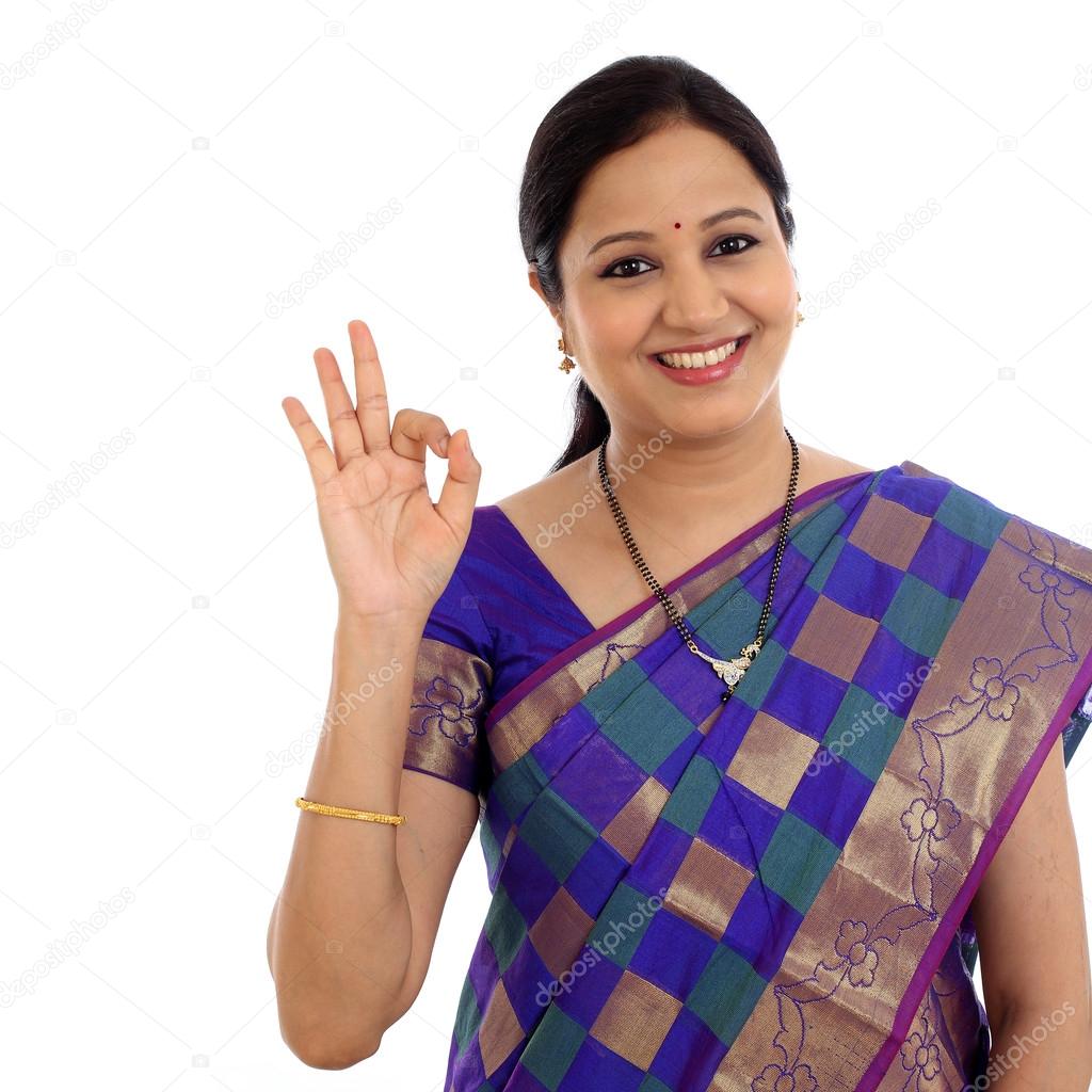 Traditional Indian Young woman making OK sign