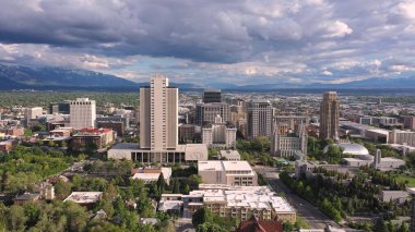 Rotating aerial view looking at downtown Salt Lake City Utah and Temple Square. clipart