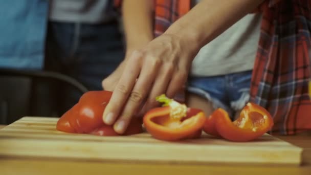 Close up of woman cutting pepper. — Stock video