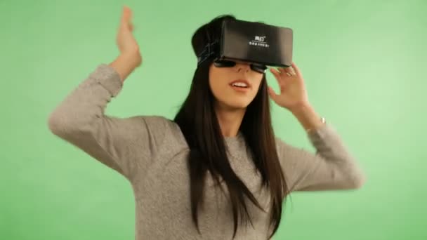 LVIV, Ukraine - NOVEMBER 26, 2015: Girl in virtual reality is smilling and it makes him laughing. Green screen — Stock Video