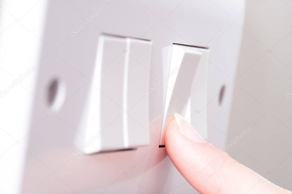 Finger Turning on Light On a 4 Gang Switch Plate