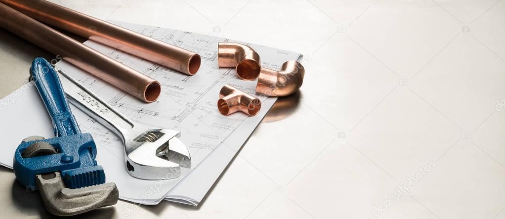 Plumbers Tools and Plumbing Materials Banner with Copy Space