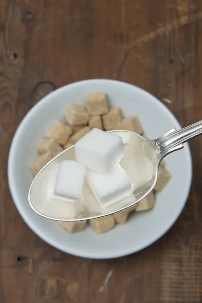 stock image SUGAR CUBES ON CEREAL SPOON