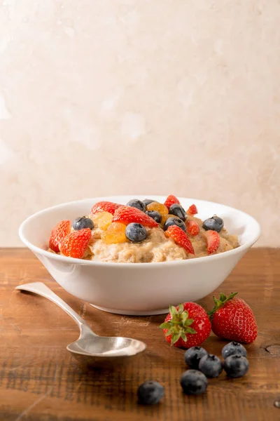 Breakfast Porridge Strawberries Blueberries Top Spoon Side Space Text Copy — Stock Photo, Image
