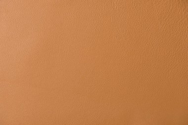 Bir liht kahverengi deri swatch bir bölümünün yakın genelinde tahıl ve ışık bir mil gösteren