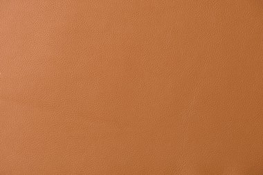 Gren ve bir ışık şaftı gösteren koyu tan deri bir swatch bir bölümünün yakın