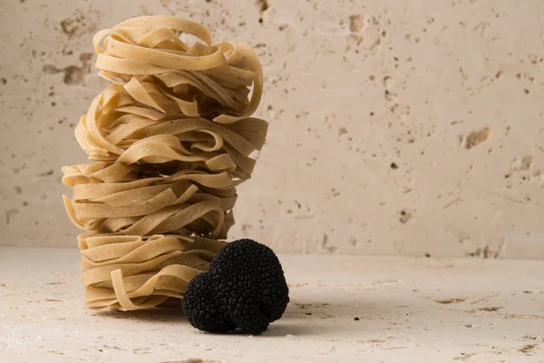 Fettuccine Nests and Black Truffle with Copy Space — Stock Photo, Image
