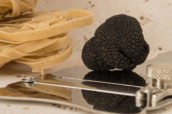 Truffle on Steel Slicer Alongside Pasta — Stock Photo, Image