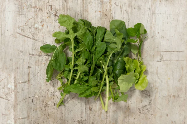 MIxed Salad Greens on a Wooden Surface — Stock Photo, Image