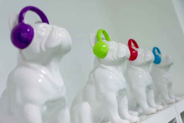 Ceramic Pugs with Colorful Earmuffs on Display