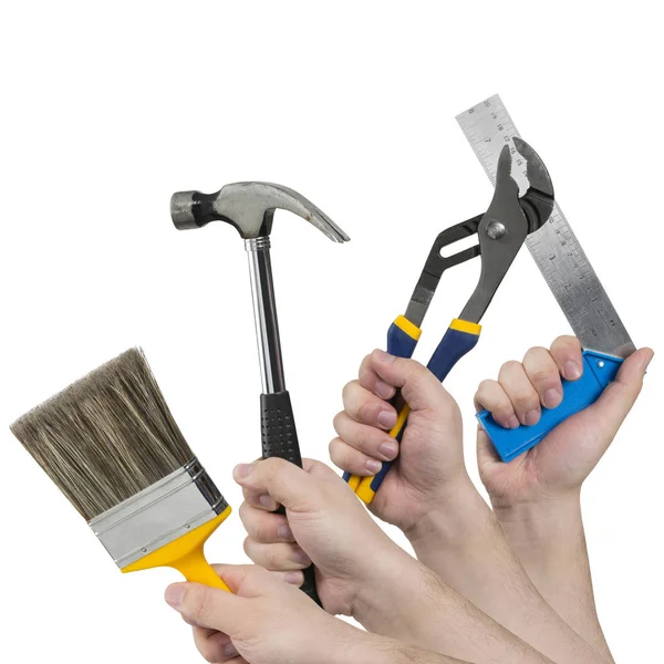 Kvadratisk bild av händer som håller olika konstruktion verktyg — Stockfoto