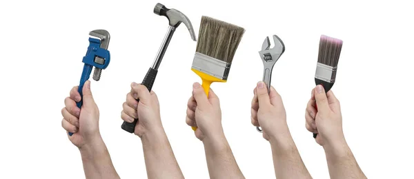 Händer som håller konstruktion verktyg — Stockfoto