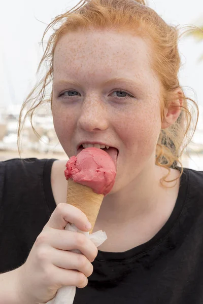 Redhead Girl Licking Pink Ice Cream on Cone — Stock Photo, Image