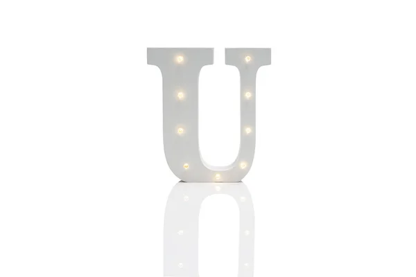 Dekoratif harf U with beyaz Backgrou üzerinde katıştırılmış Led ışıkları — Stok fotoğraf