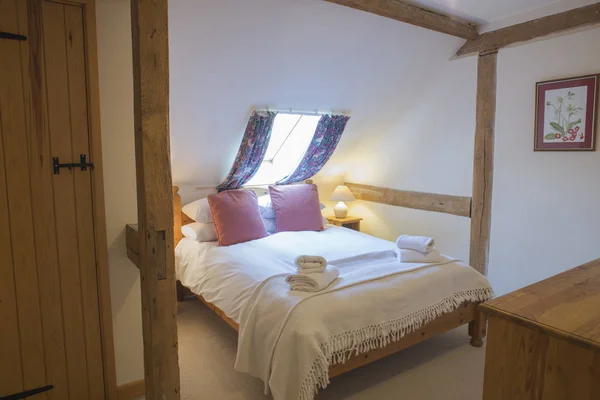 Interior of Fully-Furnished Attic Bedroom of Posh Vacation Home