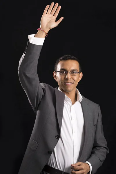 Jonge Man in Office kleding inzamelen of zwaaien zijn rechterhand — Stockfoto