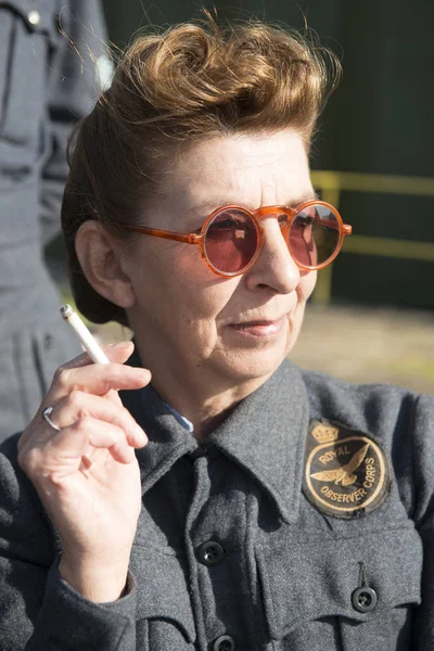 Female Royal Observer Corps Veteran Holding a Cigarette