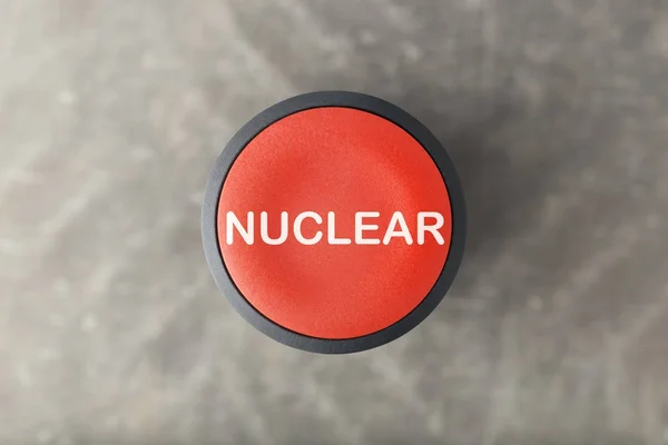 Overhead of Red Nuclear Pulsador sobre fondo gris borroso — Foto de Stock