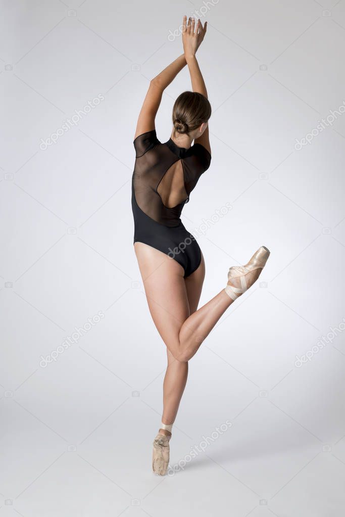Back View of Woman in Black Leotard Dancing Ballet