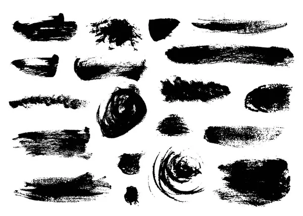 Ensemble de petits coups de pinceau noirs touffus — Image vectorielle