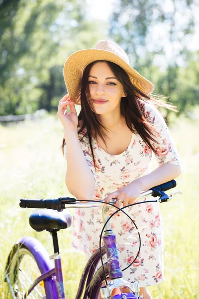 Happy pretty young girl bicycling on summer park. Happy relax time in city. Beautiful woman, sunny day — Stock Photo, Image