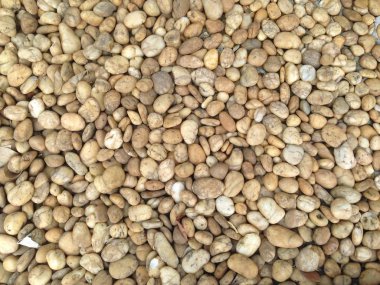 Arka plan birkaç kahverengi ve yuvarlak taşlardan oluşur