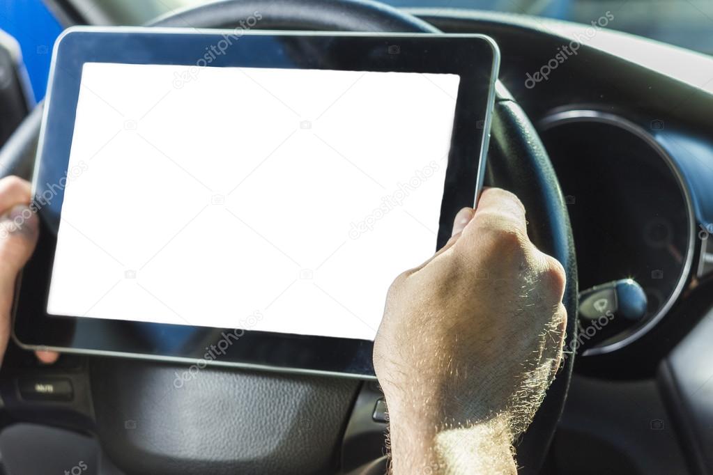 The man in the car, with the Tablet in hands