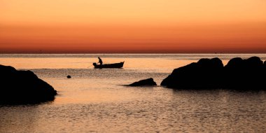Fisherman at dawn clipart