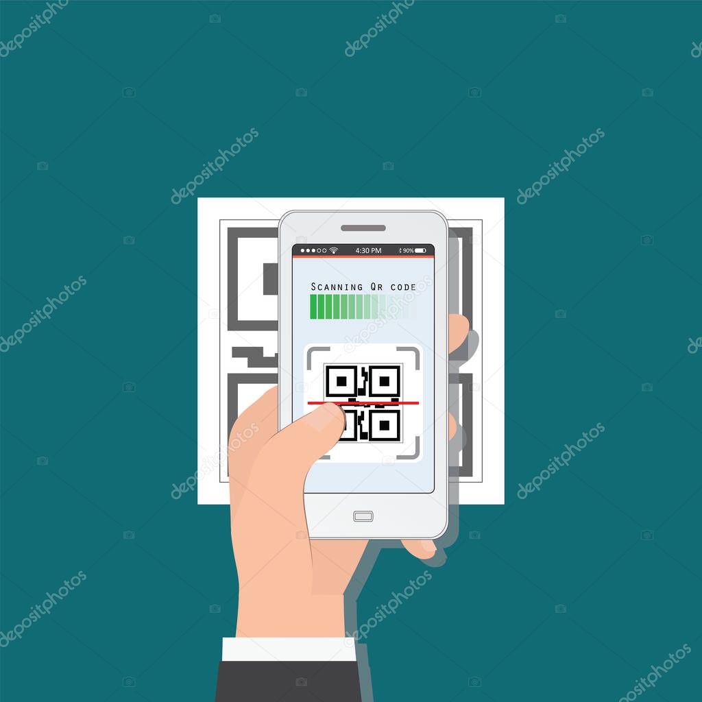 Hand holding mobile phone scanning QR code from document