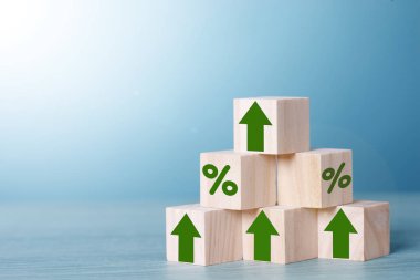 Wood block cubic stacking as step stair with green arrow up and Percent. Business growth success process. Business Concept.