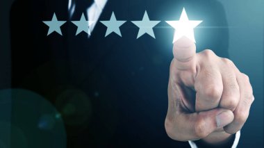 Businessman without head pointing five star visual symbol to increase rating of company. COPY SPACE.