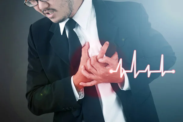 Asian Man in suit having heart attack / heart burn With Heart Beat Visual Graphic.