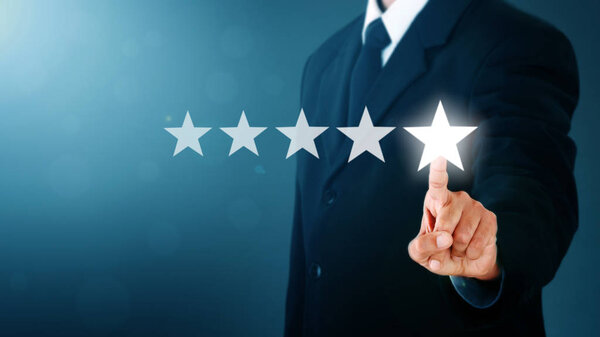 Businessman without head pointing five star visual symbol to increase rating of company. COPY SPACE.