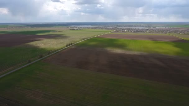 Aerial shot of the fields near the Dnipro river with splendid skyscape in spring — Stock Video