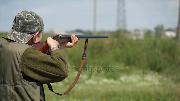 Nikolaev, Ukraine - May 20, 2017:Middle aged man shooting at some clay target while training in slo-mo — Stock Video