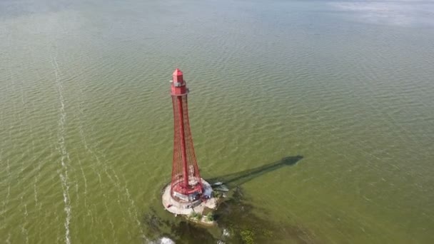Aerial shot of a dark brown lighthouse near Dzharylhach island in Ukraine — Stock Video