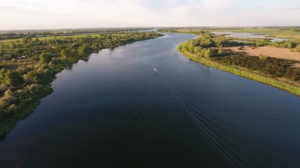 Aerial shot of the Dnipro river and  green riverbanks in a sunny day in summer — Stock Video