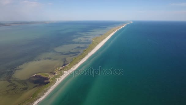 Aerial shot of an extended and narrow island in the Black Sea covered with sand — Stock Video