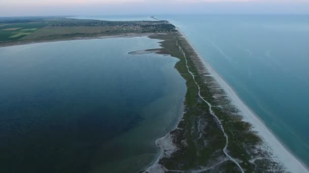 Aerial shot of a triangular narrow island in the Black Sea on a sunny day — Stock Video