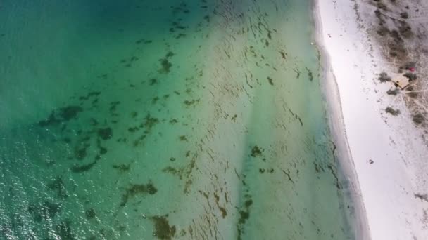 Aerial shot of a sandy seacoast with multicolored shoal in the Black sea — Stock Video