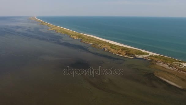 Aerial shot of an extremely long sand spit of Dzharylhach island at sunset — Stock Video