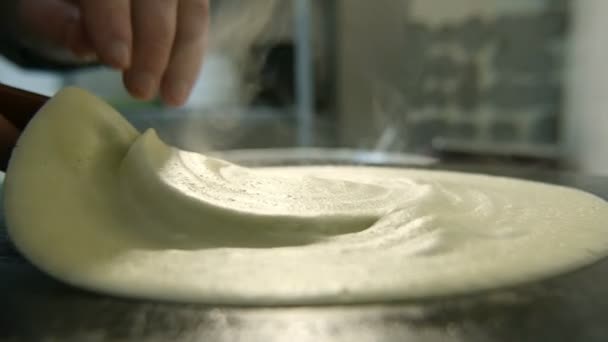 Big Pancake Cooking Hand Witha Spatula Raises Slo Astonishing Closeup — Stock Video