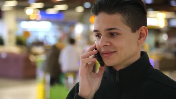 Happy Young Man Talking Smartphone His Girlfriend Supermarket Closeup Cheery — Stock Video