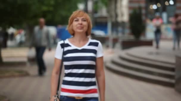 Cheery Blond Woman Walks Green Street Smiles Sunny Day Portrait — Stock Video