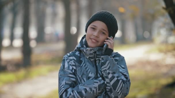 Smiling Kid Knitted Hat Chatting His Mother Phone Outdoors Autumn — ストック動画