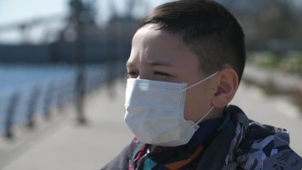 Small Boy Sanitary Mask Covid Quay Sunny Day Spring Warning — Stock Video